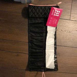 Black beauty roll with pink zipper and tab